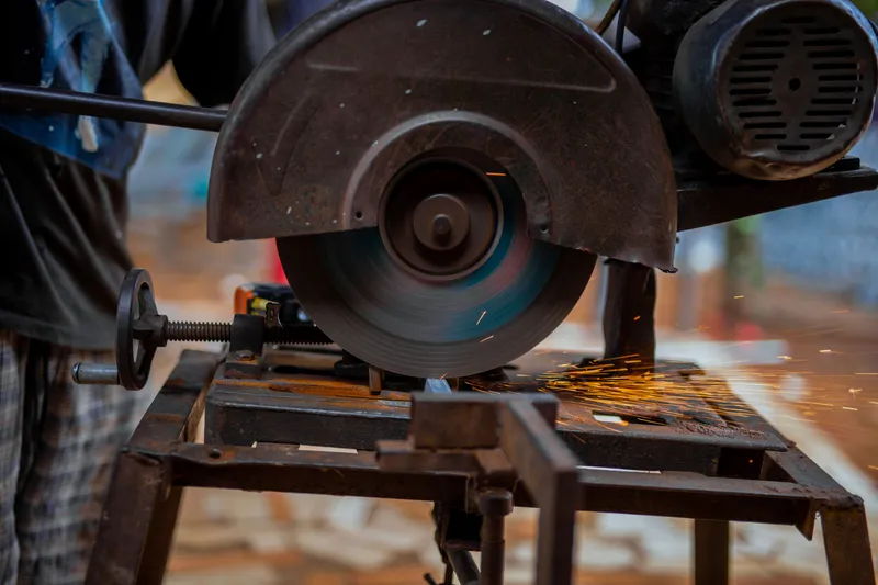 Abrasive metal cutting with bright orange sparks