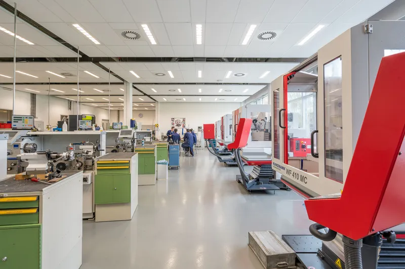 Modern machine workshop with rows of precision manufacturing equipment